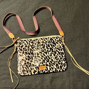 The Downtown Crossbody is a sleek with an interior slide pocket